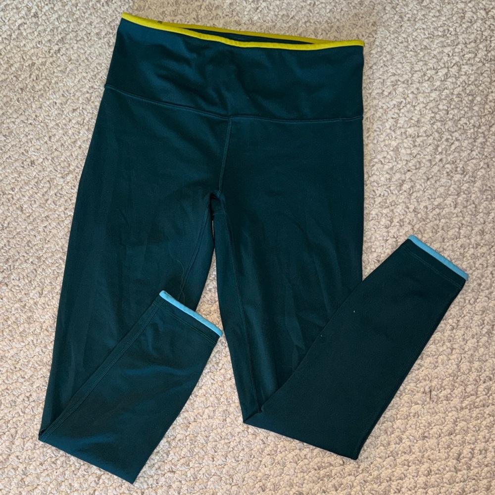 cotopaxi Deep Teal Leggings with Yellow Waistband and Light Blue Cuffs